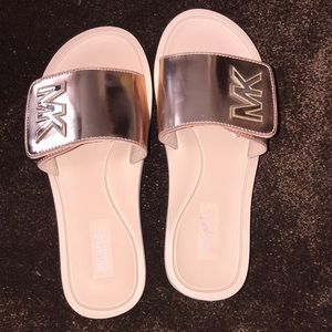 Pink and rose gold Michael Kors slides